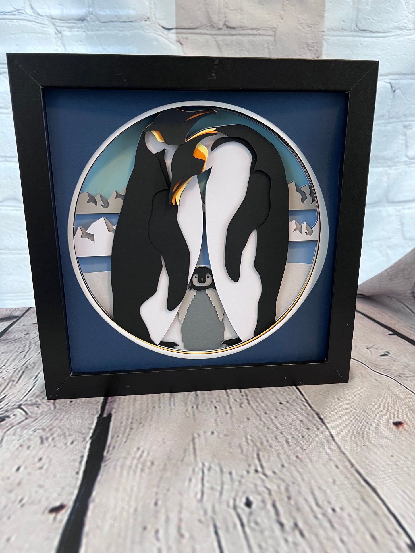 Penguin family 3D paper art in a shadowbox